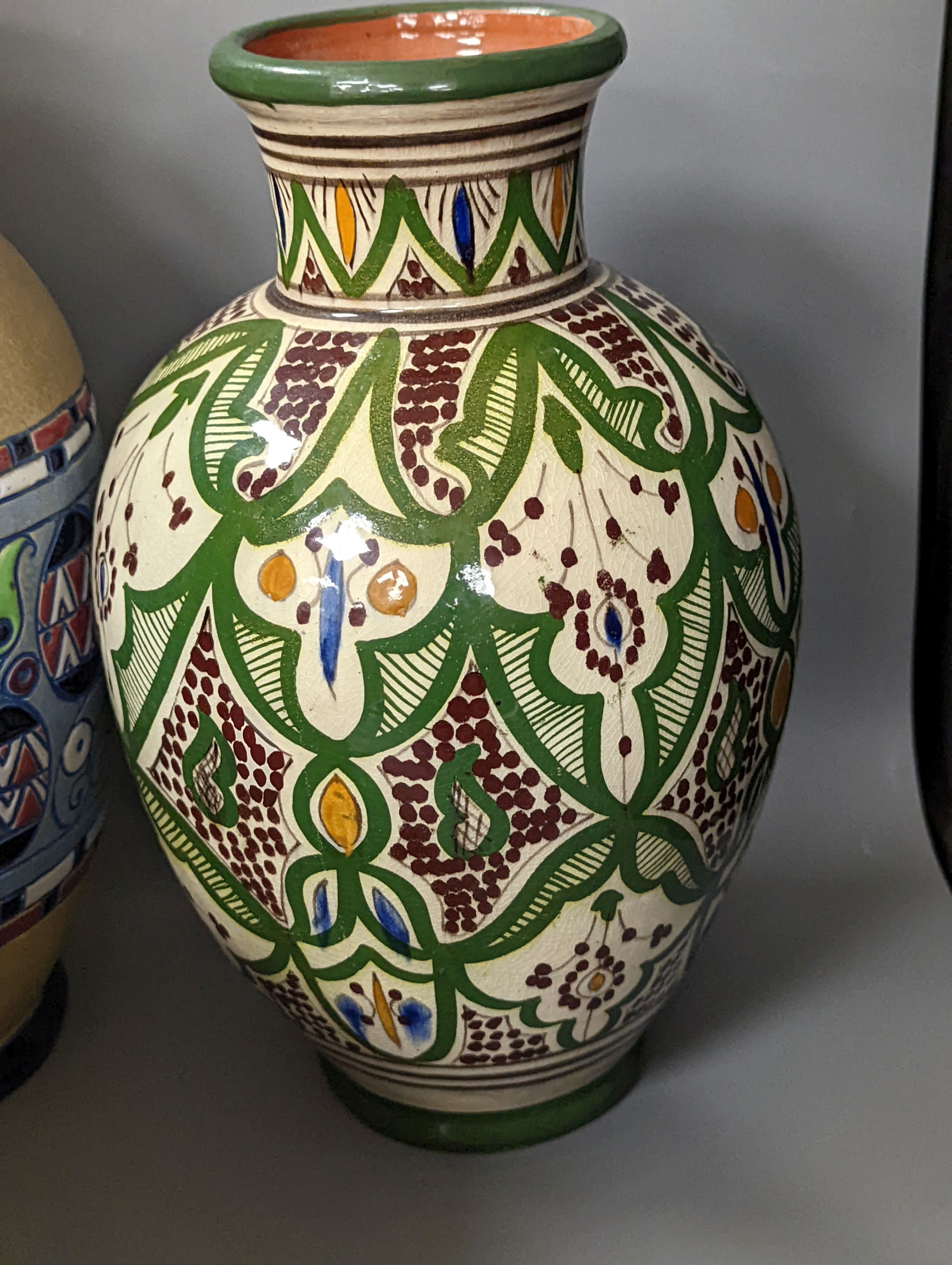 A Mont Saint Michael jardiniere, a lidded jar, two vases and an Amphora chicken decorated vase, Amphora vase 36 cms high.